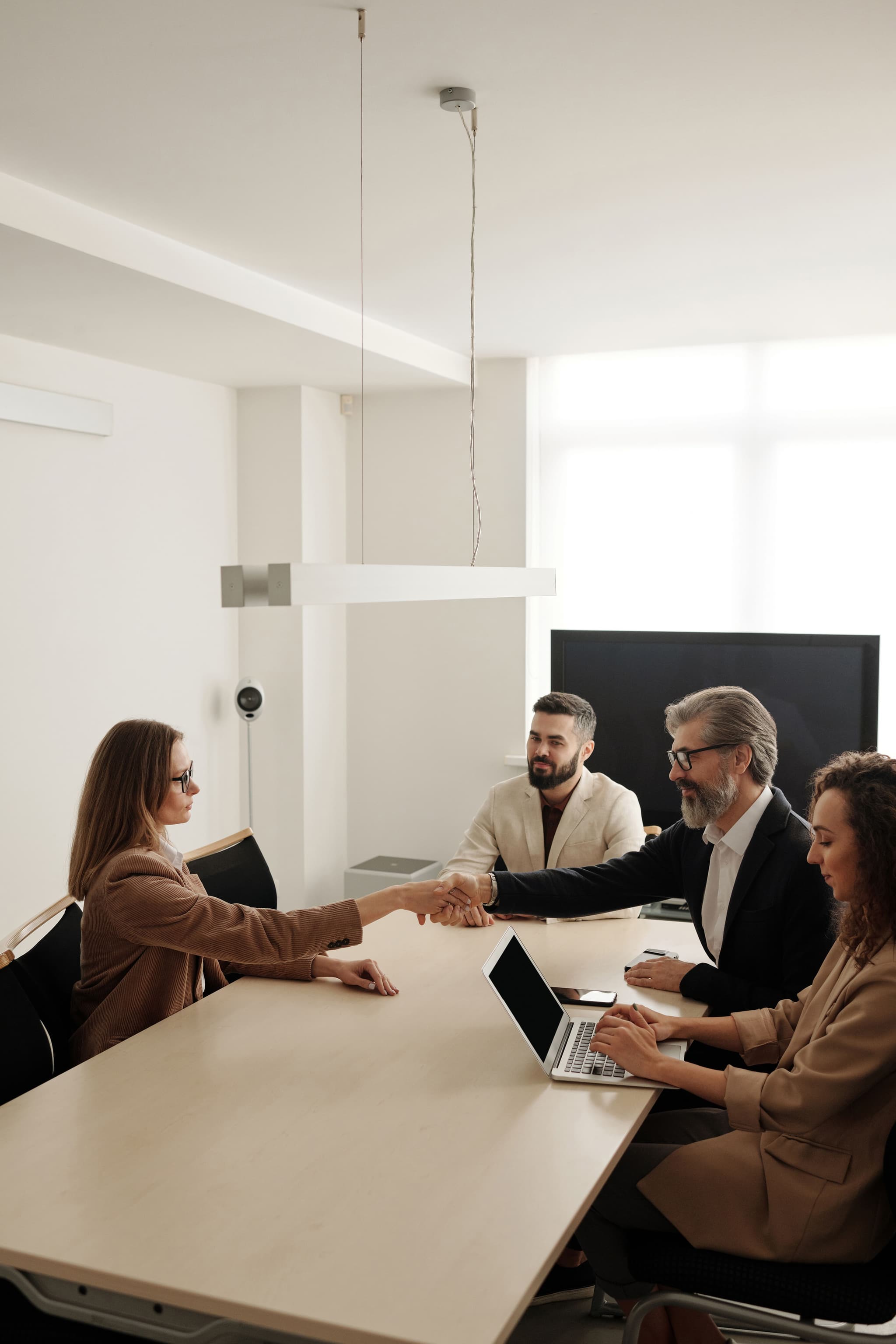 Employer welcoming a new hire placed through Mintex Staffing